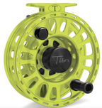 Fly-fishing Tibor reel with a bright yellow frame and black components on a white background