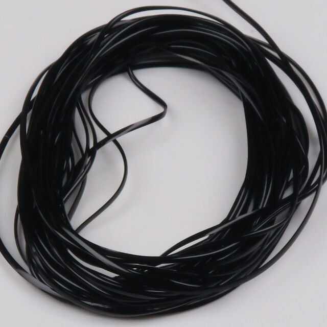 Coiled black Hareline Vinyl Rib on a white background