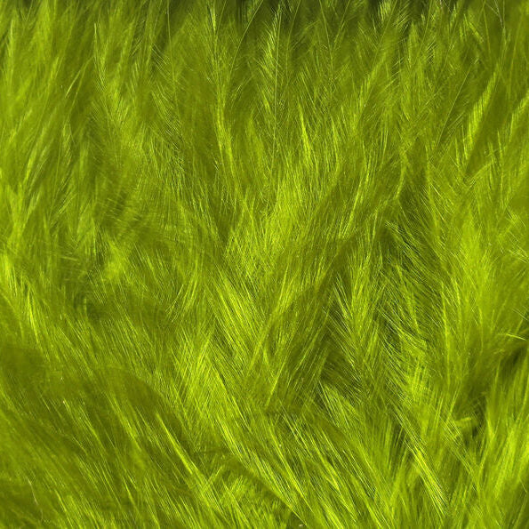 A collection of Hareline Woolly Bugger Marabou feathers in olive, arranged on a wooden surface.