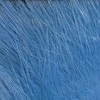 A close-up of a bundle of blue, Hareline Arctic Fox Hair for fly tying, commonly used in crafting fishing flies.