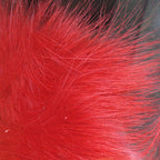 A close-up of a bundle of red, Hareline Arctic Fox Hair for fly tying, commonly used in crafting fishing flies.