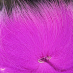 Colorful fox tail hair on a wooden surface