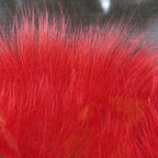 Colorful fox tail hair on a wooden surface