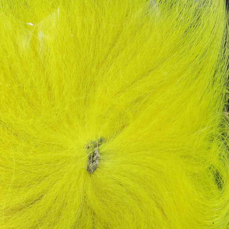Colorful fox tail hair on a wooden surface