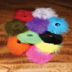 Colorful Hareline Arctic Fox Zonker Strips on a wooden surface