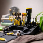 Set of tools and accessories on a black Loon Bench Boss with a blurred background