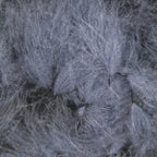 A collection of various sized Hareline CDC Oiler Puffs feathers arranged on a wooden surface.