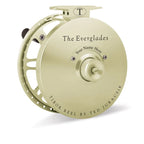 A collection of Tibor fly fishing reels in different colors displayed horizontally. The reels are labeled with their model names.