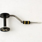 A Rite Bobbin Half Hitch with a black and green handle, a silver metal guide, and a yellow and black striped resistance band, isolated on a white background.