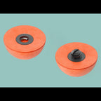 Two orange OROS indicators with black centers on a light blue background