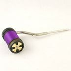 A Rite Bobbin Magnum with a black and green handle, a silver metal guide, isolated on a white background.