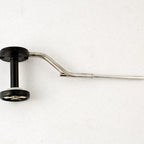 A Rite Bobbin Magnum with a black and green handle, a silver metal guide, isolated on a white background.