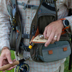 Fisherman wearing a Fishpond Sagebrush Pro Mesh Vest