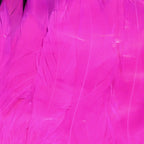 Close-up of pink Spirit River UV2 Schlappen products on a wooden surface