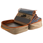 Open Fishpond beige and orange fly tying travel packing bag with gray interior on a white background