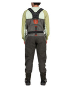 Person wearing gray Simms MEN's G3 Guide Stockingfoot Waders with a red logo on a white background