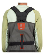 Gray Simms MEN's G3 Guide Stockingfoot Waders with red accents on a person wearing a light green shirt.