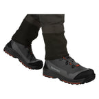 Gray hiking boots with orange accents worn by a person on a white background