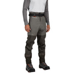 Person wearing gray and black waders with a white shirt on a white background