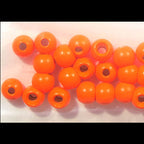 Orange Hareline Dazzle Brass Beads on a light pink background