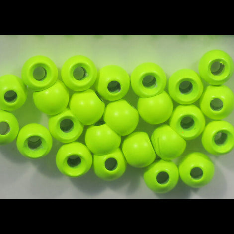 Green Hareline Dazzle Brass Beads with holes on a light gray background