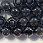 Collection of metallic beads on a white background