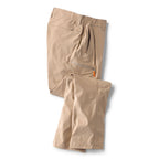 A pair of beige Orvis men's quick-dry pants laid out flat, showing the front pockets and the waistband.