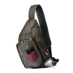 A gray Orvis sling pack designed for fly-fishing, featuring multiple storage compartments and oa water bottle holder.