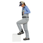 Person wearing gray Orvis women waders with suspenders on a white background while stepping on a cube. 