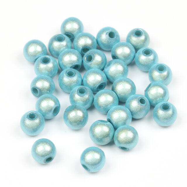 Light blue Hareline 3D Beads with pearl-like finish on a white background