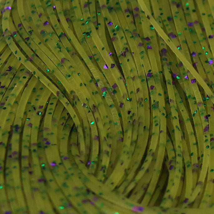 Close-up of green Hareline Crazy Legs with glittery specks on a green background