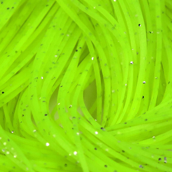 Close-up of bright green Hareline Crazy Legs with speckles on a white background