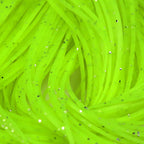 Close-up of bright green Hareline Crazy Legs with speckles on a white background