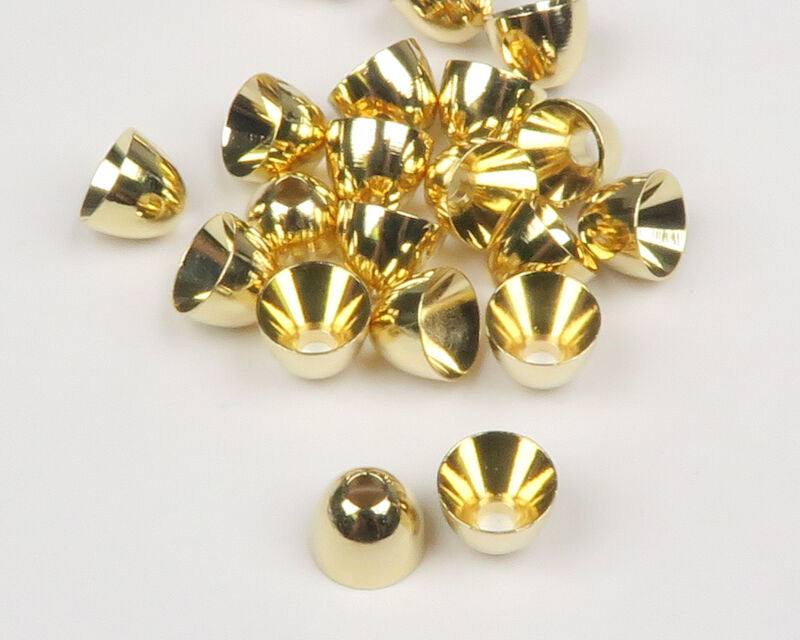 Gold Hareline Brass Cone Heads on a white surface