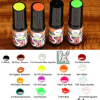 Four bottles of Solarez Fly Tie Color UV Resins on a wooden surface with color swatches and item code.
