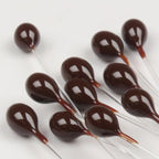 Black Hareline Epoxy Mono Crab Eyes on a white background