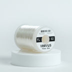 Spool of Veevus floss on a white background