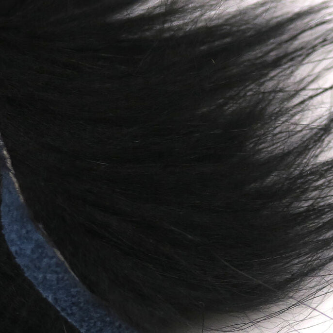 Close-up of dark Hareline Finn Raccoon Zonker with a blurred background
