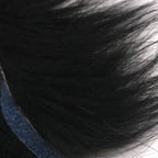 Close-up of dark Hareline Finn Raccoon Zonker with a blurred background