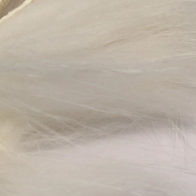 Close-up of white Hareline Finn Raccoon Zonker
