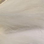 Close-up of white Hareline Finn Raccoon Zonker