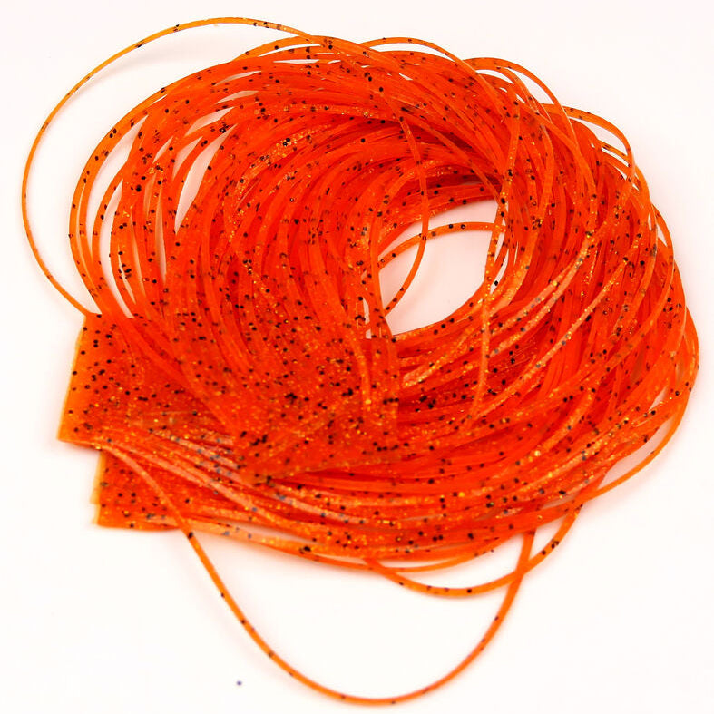 Close-up of orange Hareline Loco Legs on a white surface