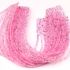 Close-up of pink Hareline Loco Legs on a white surface