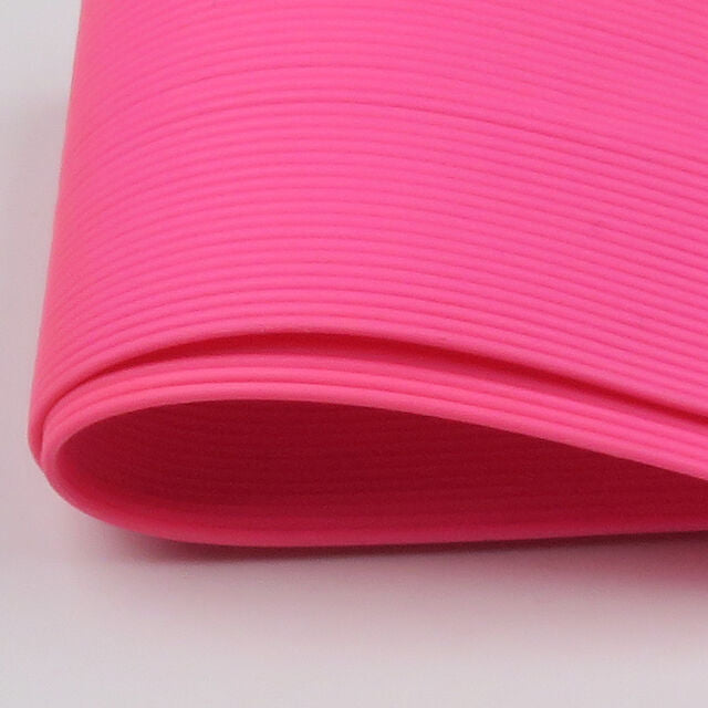 Close-up of a pink Hareline Medium Round Legs on a light gray background