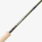 A two-handed Sage Sonic Switch and Spey Fly Rod with a cork handle and a graphite rod body, featuring charcoal and gunmetal trim wraps.