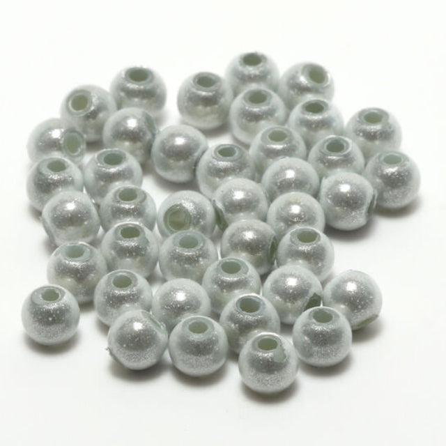 White Hareline 3D Beads on a white background