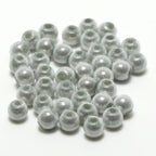 White Hareline 3D Beads on a white background