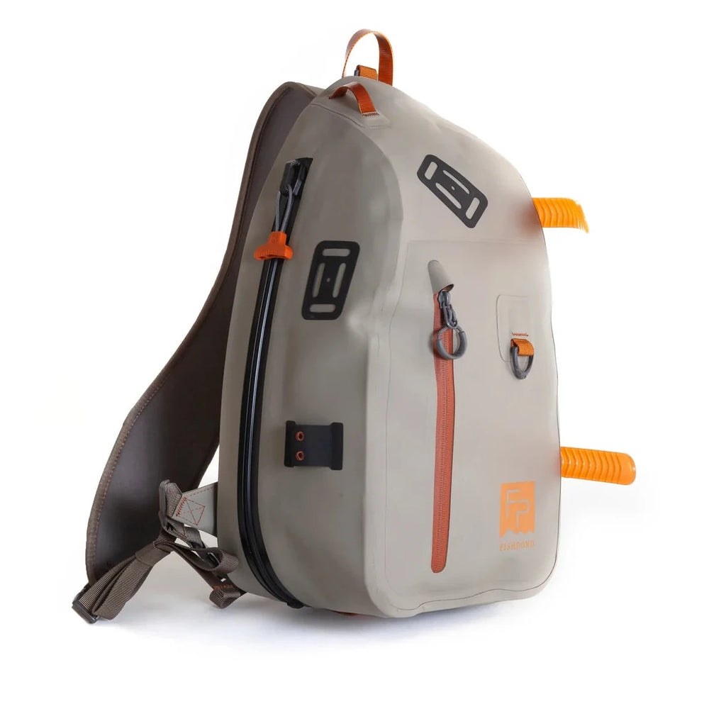 Gray Fishpond Thunderhead Submersible Sling Pack with orange accents on a white background