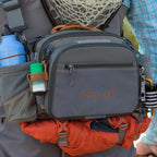 Angler wearing a Fishpond Waterdance Pro Guide Pack outdoors
