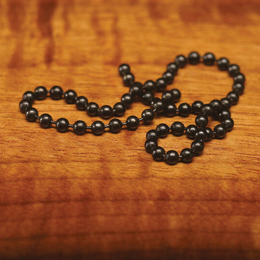 Black Hareline Bead Chain Eyes on a wooden surface